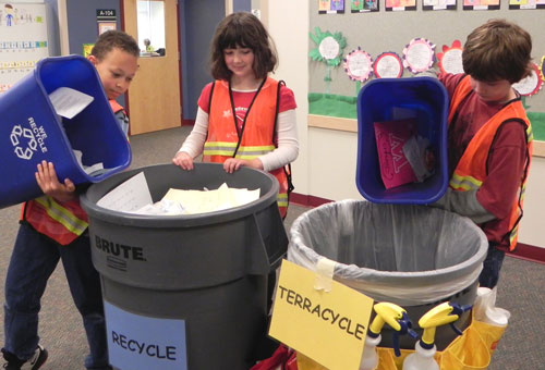 Student "Roadrunner Recyclers" help empty recycling containers