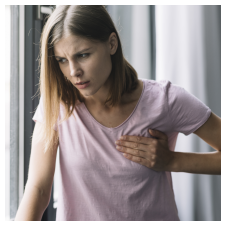 Woman experiencing chest pain