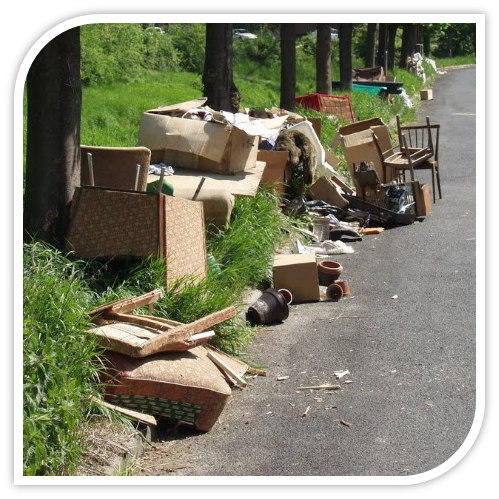Illegal dumping of garbage on side of road