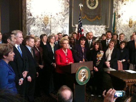 Washington Governor Christine Gregoire signs into law the recently adopted marriage equality legislation