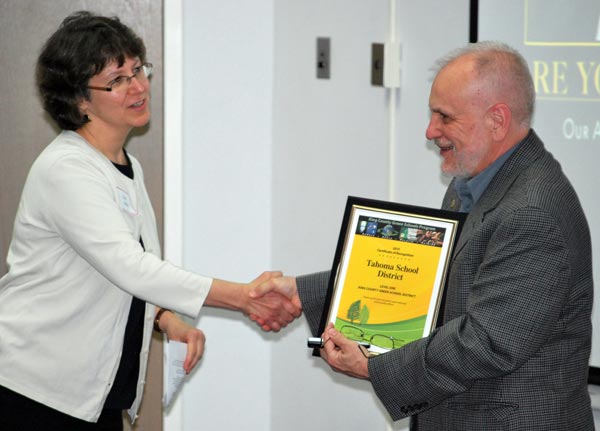 Tahoma School District superintendent Mike Maryanski receives certificate of recognition from Dale Alekel