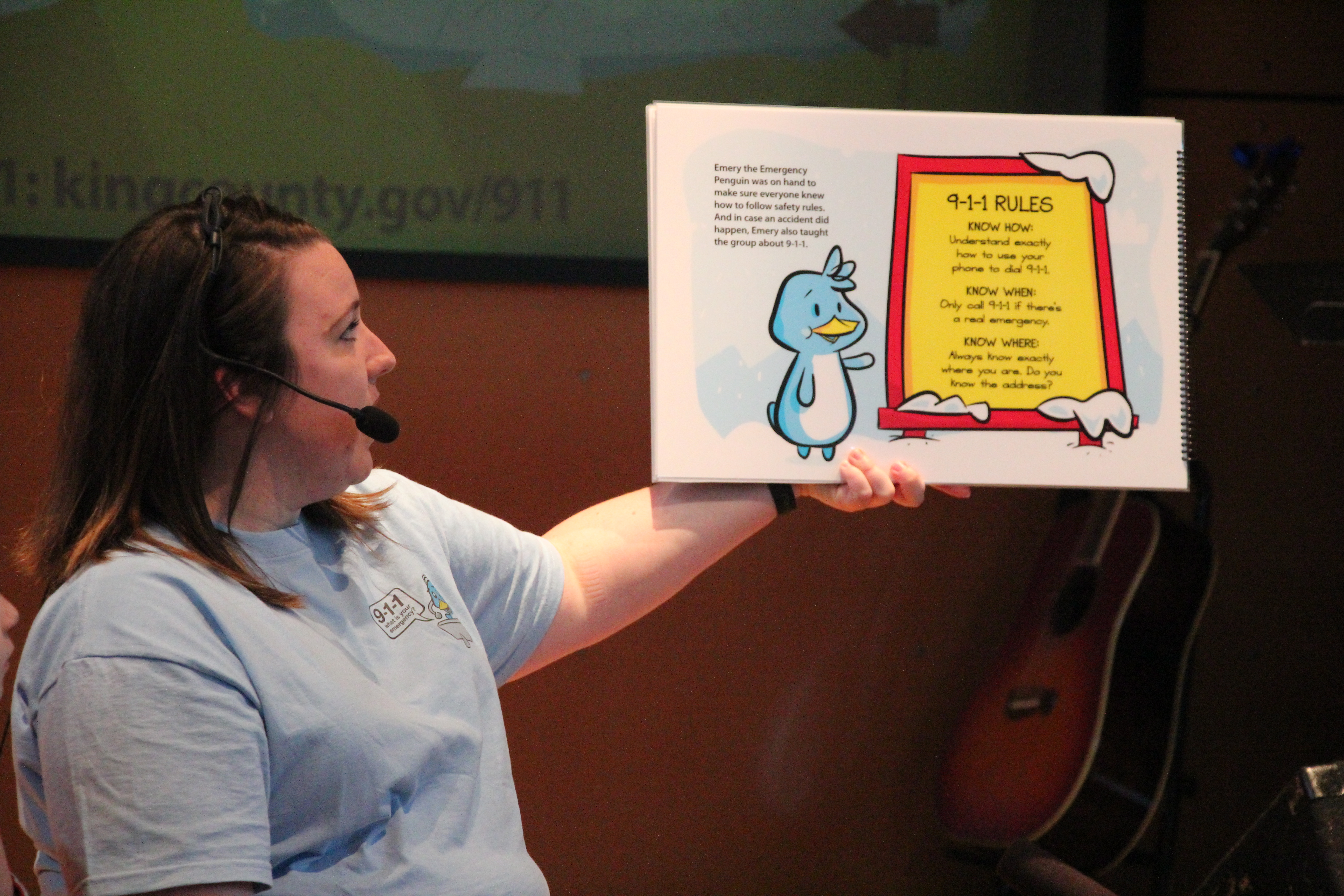 Jennifer Lemus, a Seattle Police Department 9-1-1 dispatcher, reads the new storybook 