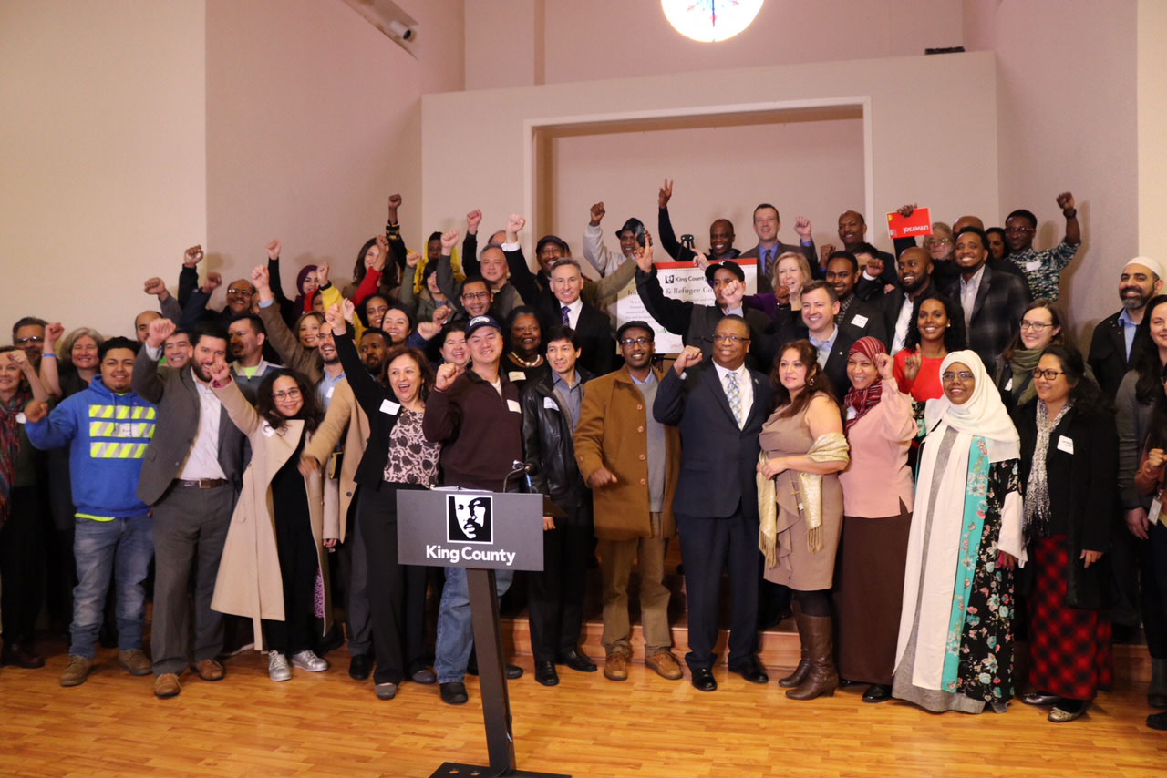 Executive Constantine and members of the County Council join with members of the immigrant and refugee community to celebrate the newly established King County Immigrant and Refugee Commission.