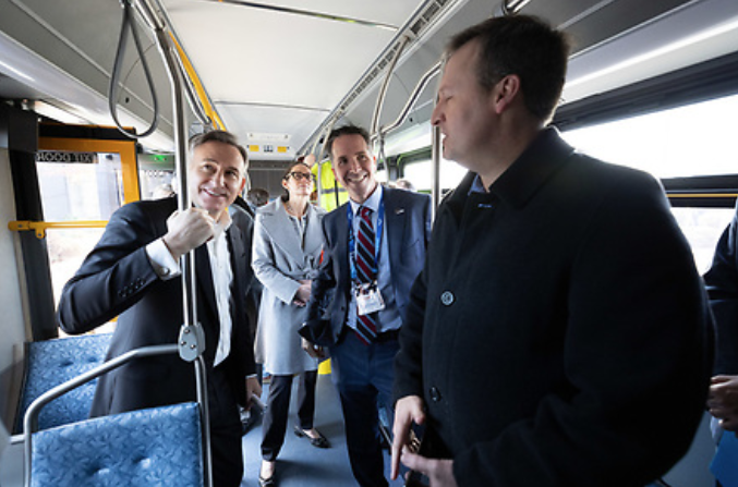Executive Constantine joins staff and partners aboard one of the long-range battery-powered buses King County Metro will test.