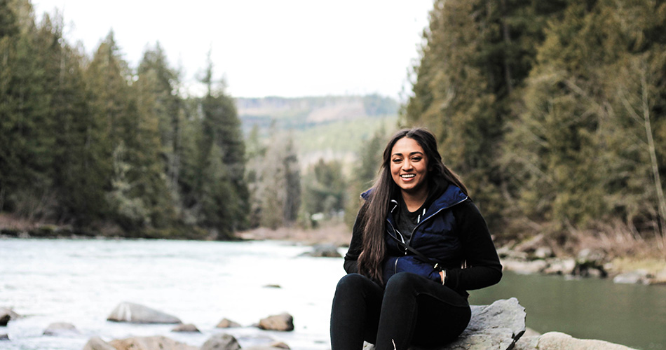 Woman outdoors watching the river flow