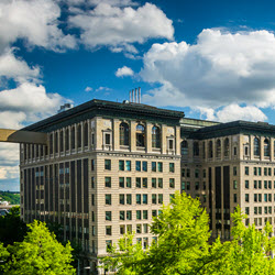 Photograph of the King County Courthouse with blue sky and clouds in the background.