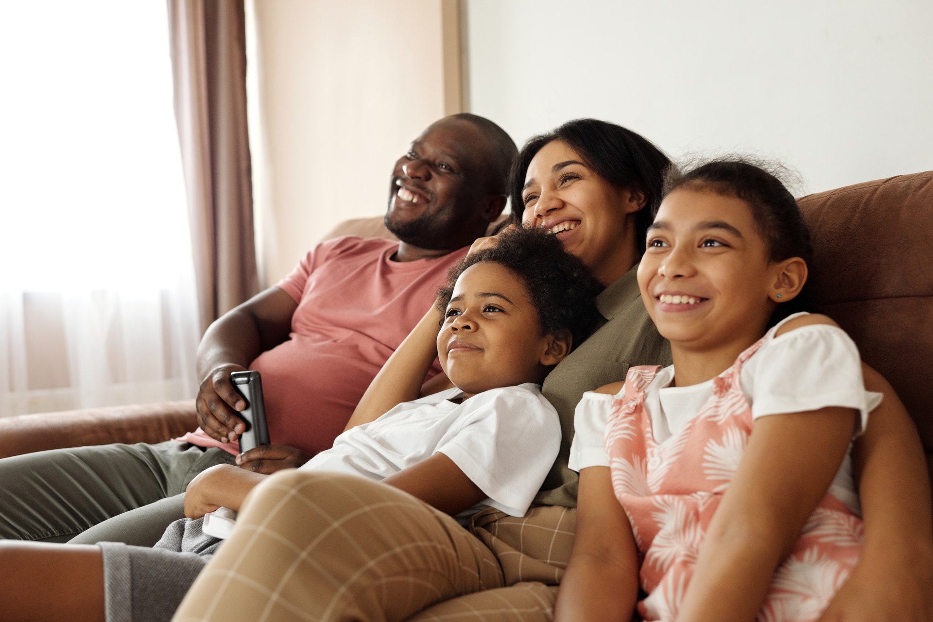 Family sitting in living room