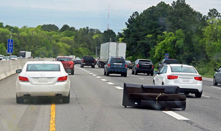 couch on freeway as result of unsecured load