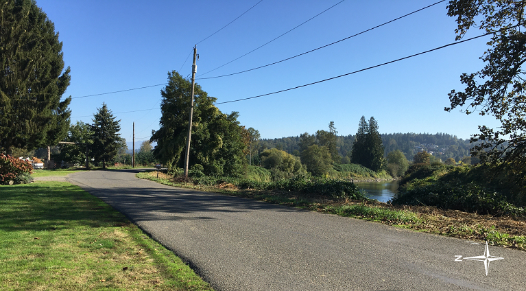 Photo of West Snoqualmie River Road Northeast with the Snoqualmie River and the Dutchman Road Revetment on the right.