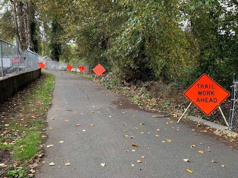 Photo of signage on a trail notifying users of construction impacts from a project in 2020.