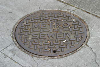  Many King County sewer manholes have 'METRO' on the lid.