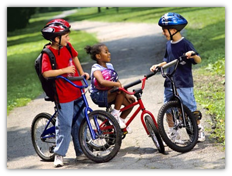 Children wearing bike helmets