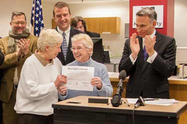 Executive Constantine signs the first same-sex marriage license application