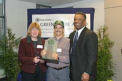 Cascade Farm accepting their award from Executive Sims