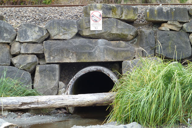 sign above stream pipe