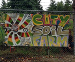 CitySoil Farm sign on a fence