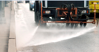 truck street sweeping using water