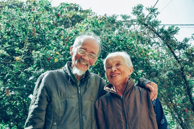 Image of a senior Asian couple standing together